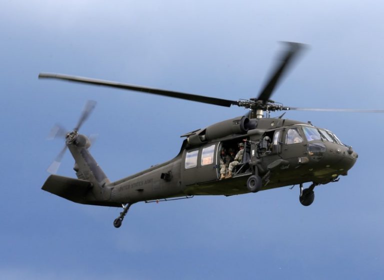 U.S. army soldiers get ready to land from Black Hawk helicopter during Suwalki gap defence exercise in Mikyciai