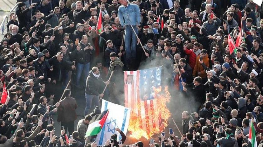 American and Israeli flag with a picture of Trump, are burned in Istanbul reuters
